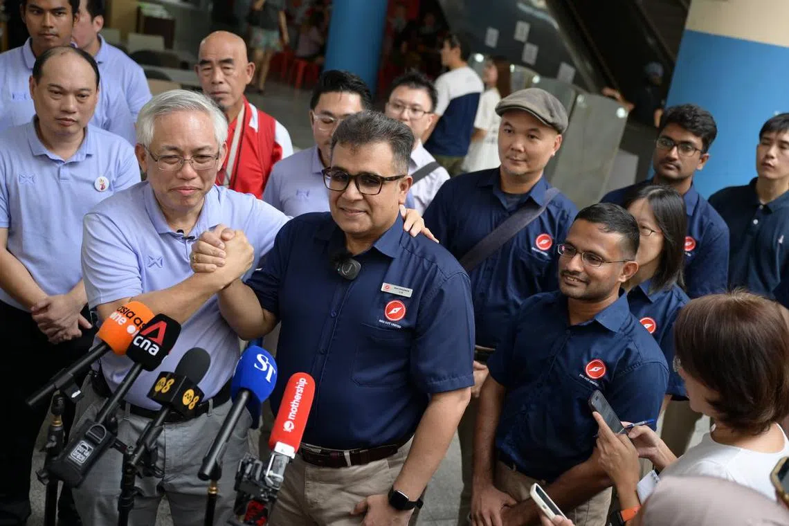 People’s Power Party’s Sec-General Goh Meng Seng (left) shakes hands with Red Dot United Sec-General Ravi Philemon at a press conference at Yishun Town Centre on March 22.
