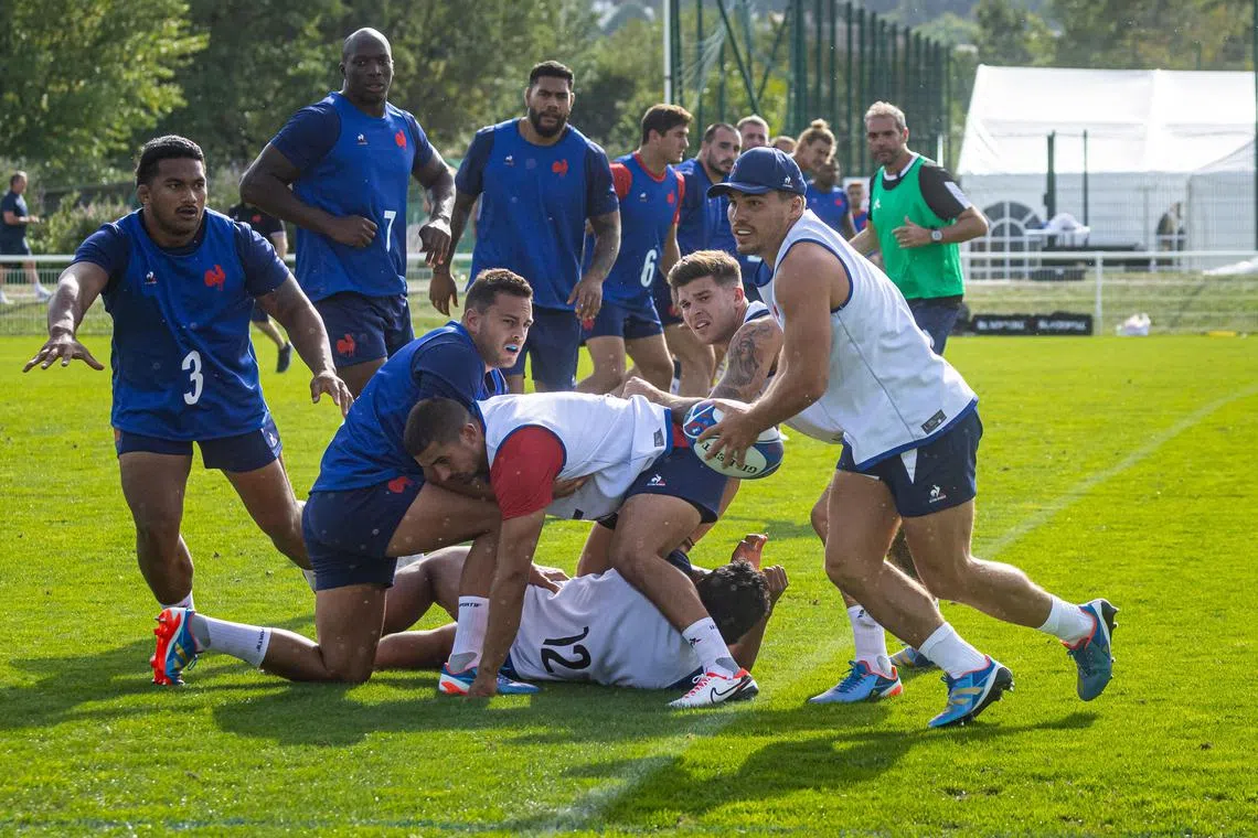 The French team, led by their skipper Antoine Dupont (with ball), during a training session ahead of the Rugby World Cup opening match against the All Blacks.