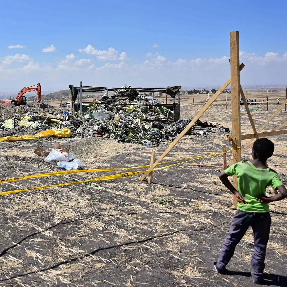 Investigators combing the crash site of a Boeing 737 MAX aircraft on March 16, 2019, at Hama Quntushele village near Bishoftu in the Oromia region, Ethiopia. 