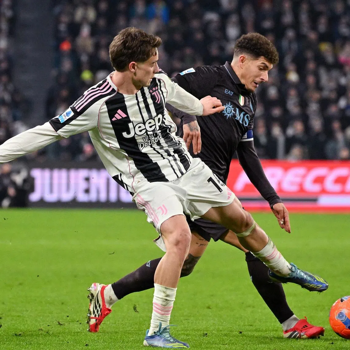 Soccer Football - Serie A - Juventus v Napoli - Allianz Stadium, Turin, Italy - January 25, 2026 Juventus' Kenan Yildiz in action with Napoli's Giovanni Di Lorenzo REUTERS/Alberto Lingria