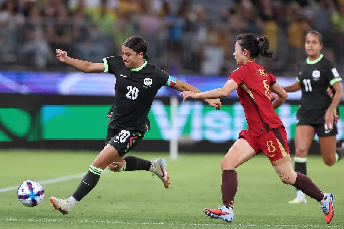 Australia's Sam Kerr (left) and China's Yao Wei fighting for the ball during the Women’s Asian Cup semi-final in Perth on March 17.