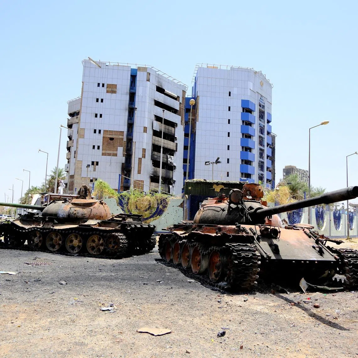 FILE PHOTO: A view of damaged tanks in front of the Central Bank of Sudan building, after the Sudanese army deepened its control over Khartoum from the Rapid Support Forces (RSF), in Khartoum, Sudan April 27, 2025. REUTERS/El Tayeb Siddig/File Photo