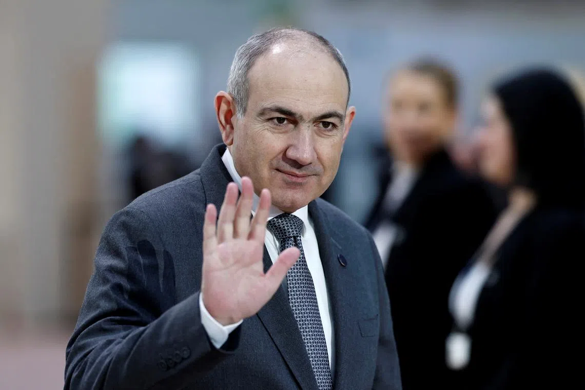 Armenia's Prime Minister Nikol Pashinyan waves as he arrives to attend the Artificial Intelligence (AI) Action Summit at the Grand Palais in Paris, France, February 11, 2025. REUTERS/Benoit Tessier/File Photo