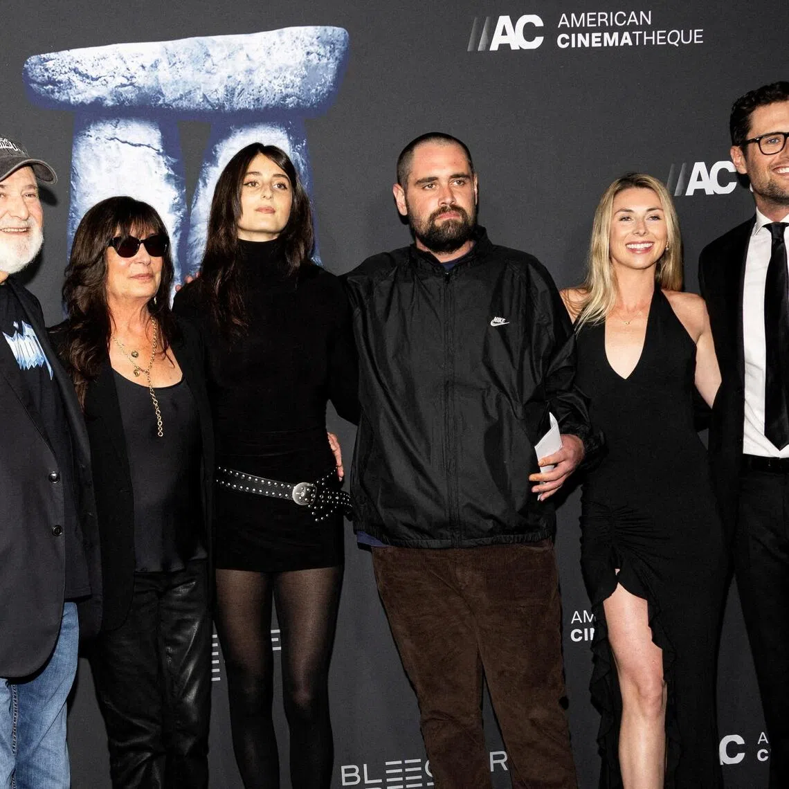 Rob Reiner (left) and his son, Nick (fourth from left) at the premiere of Spinal Tap II: The End Continues.
