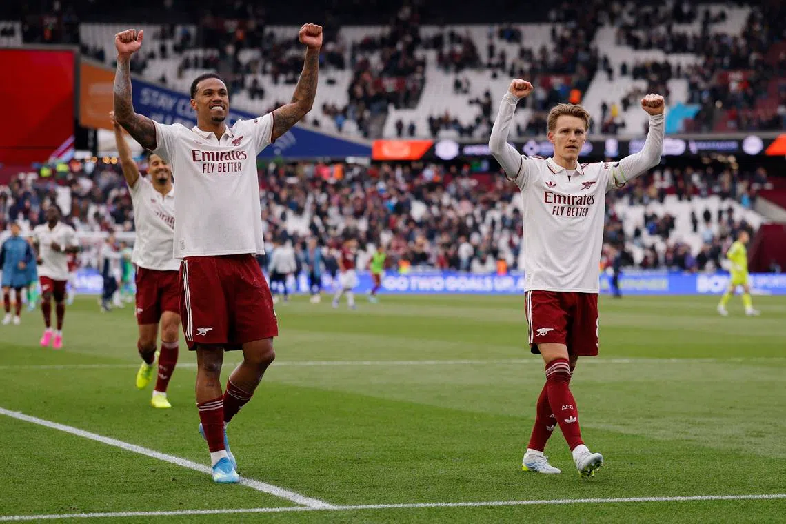Soccer Football - Premier League - West Ham United v Arsenal - London Stadium, London, Britain - May 10, 2026 Arsenal's Gabriel Magalhaes and Martin Odegaard celebrate after the match Action Images via Reuters/Andrew Couldridge/File Photo