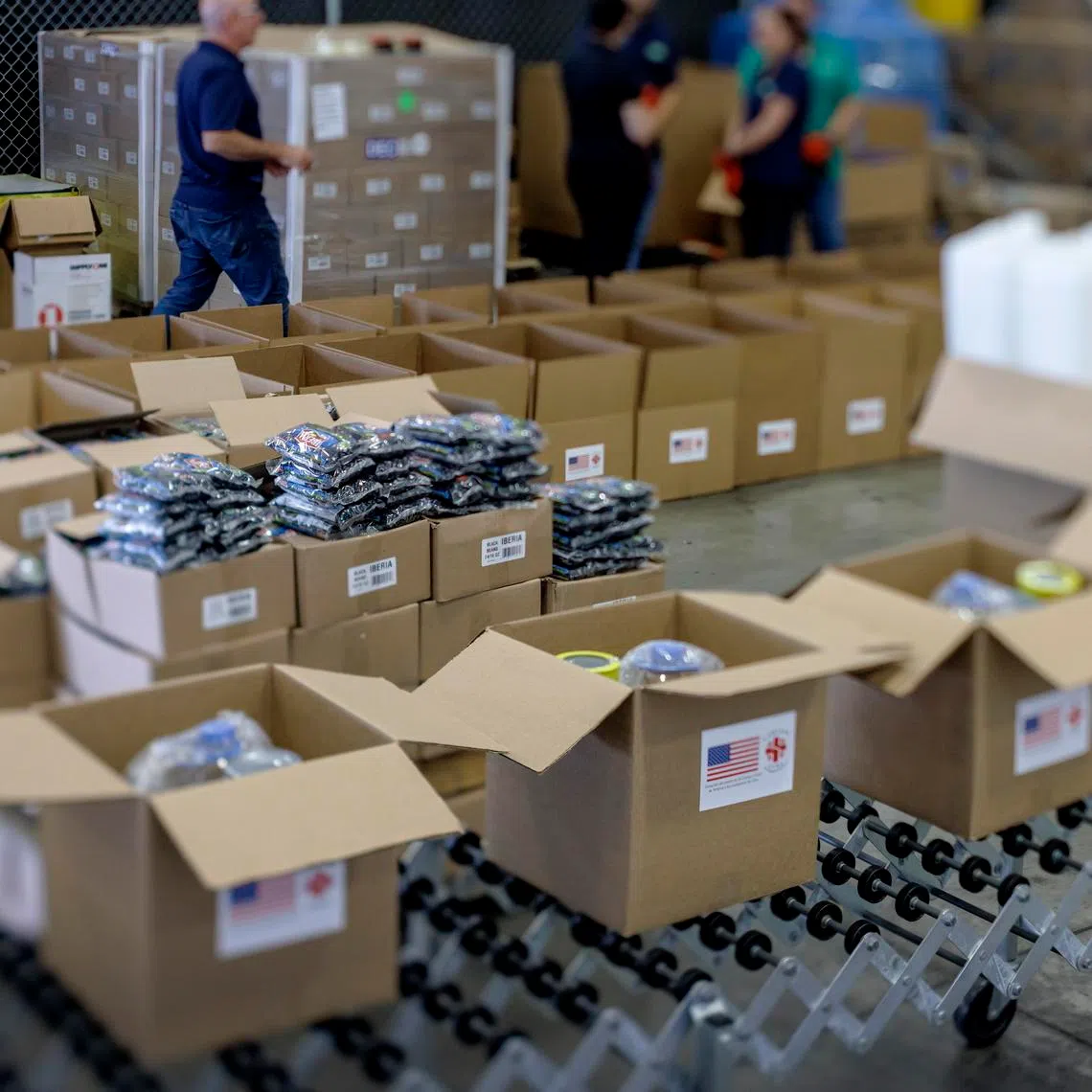 Volunteers pack initial relief supplies for Cuba at the Ecolog warehouse in Weston, Florida, on Jan 14.