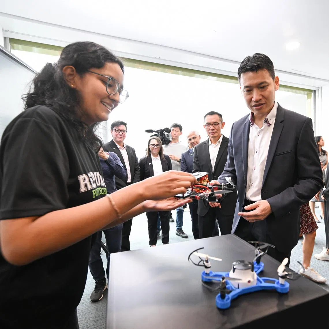 ST20260108_202635800908/etrp08/Shintaro Tay/ Miss Kymberly Uthaya Kumar, 20, a third year RP student pursuing a diploma in engineering design and business, interacting with Acting Minister for Culture, Community and Youth of Singapore and Senior Minister of State for Education David Neo and RP Principal & Chief Executive Officer Jeanne Liew at the Republic Polytechnic (RP) Al Transformation Strategy Launch at the Republic Polytechnic Industry Centre on Jan 8, 2026. 

Third year RP student Kymberly Uthaya Kumar (left) speaking with Senior Minister of State for Education David Neo and 