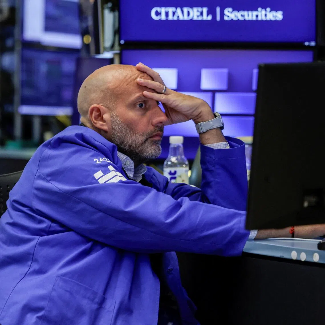 A trader working on the floor of the New York Stock Exchange, in New York City, on Aug 19.