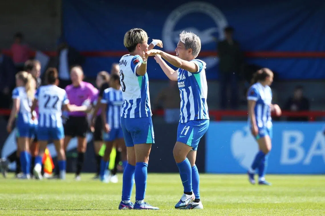 Brighton's Japanese internationals Moeka Minami (left) and Kiko Seike celebrating after their 3-2 Women's Super League win over Manchester City at Broadfield Stadium in Crawley on April 25, 2026.