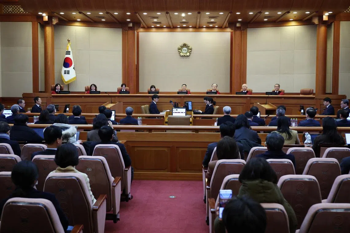 Judges of the Constitutional Court attend the impeachment trial of South Korea's impeached President Yoon Suk Yeol at the Constitutional Court in Seoul, South Korea, February 18, 2025.   REUTERS/Kim Hong-Ji/Pool