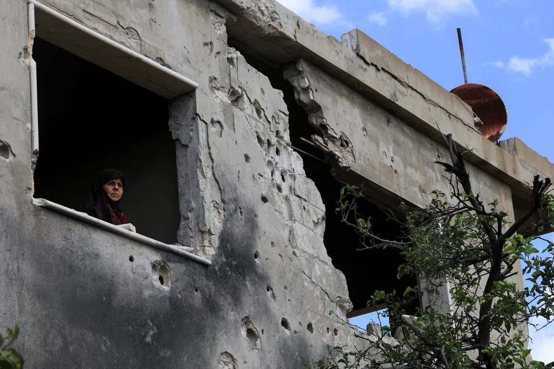 Mariam al-Yaghi ,67, Lebanese resident from West Zawtar, stands in her damaged house in southern Lebanon, October 1, 2026. REUTERS/Mohamed Azakir