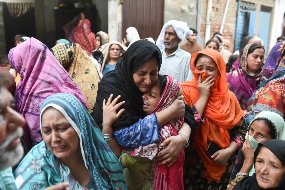 Relatives of the children who reportedly died after a tuition center roof collapsed, mourn in Lahore, Pakistan, June 30, 2026. REUTERS/Murtaza Ali
