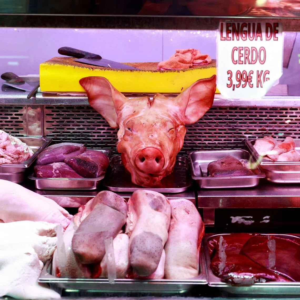 A 2024 photo shows pork products displayed at a market stall in Madrid, Spain.