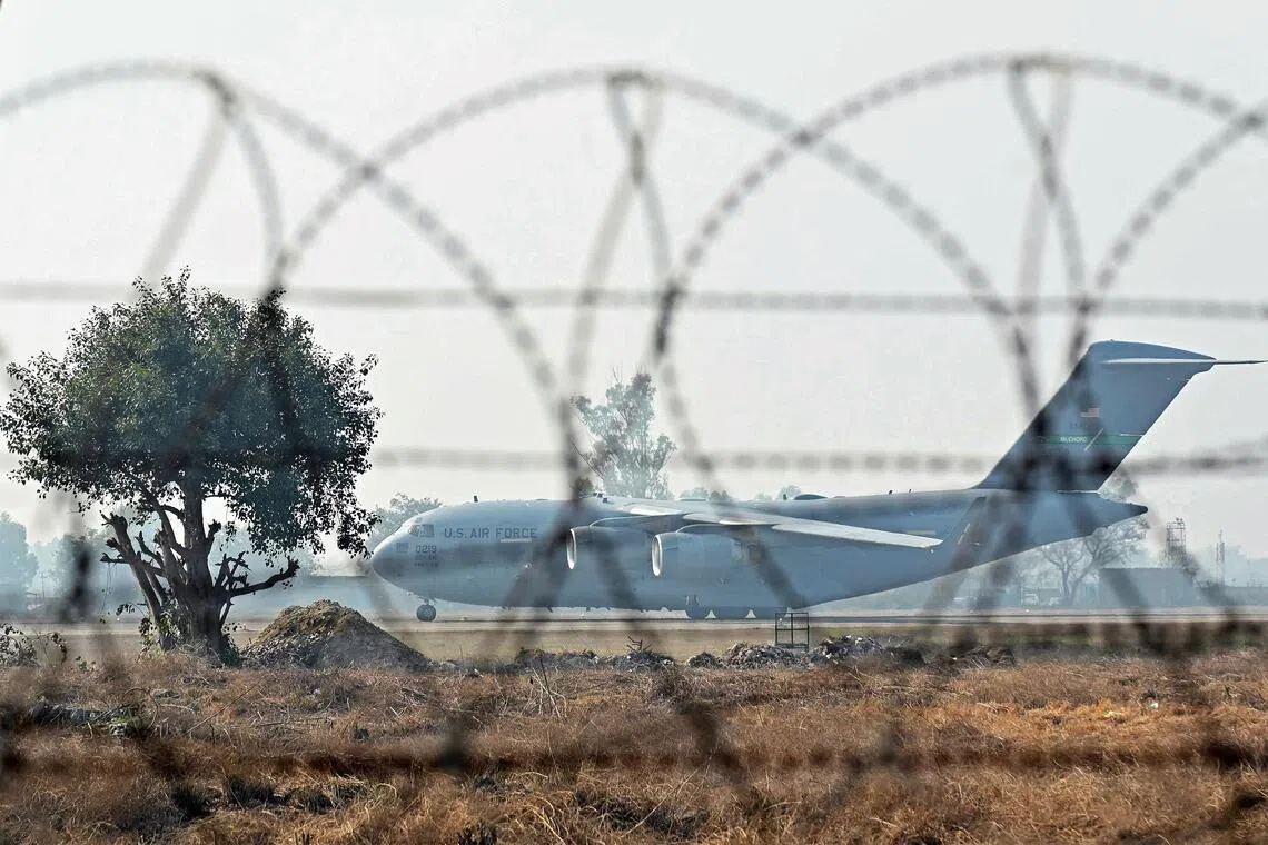 A US Air Force aircraft carrying Indian migrants deported from the United States, lands at the Guru Ram Das Jee International Airport in Amritsar on Feb 5, 2025.