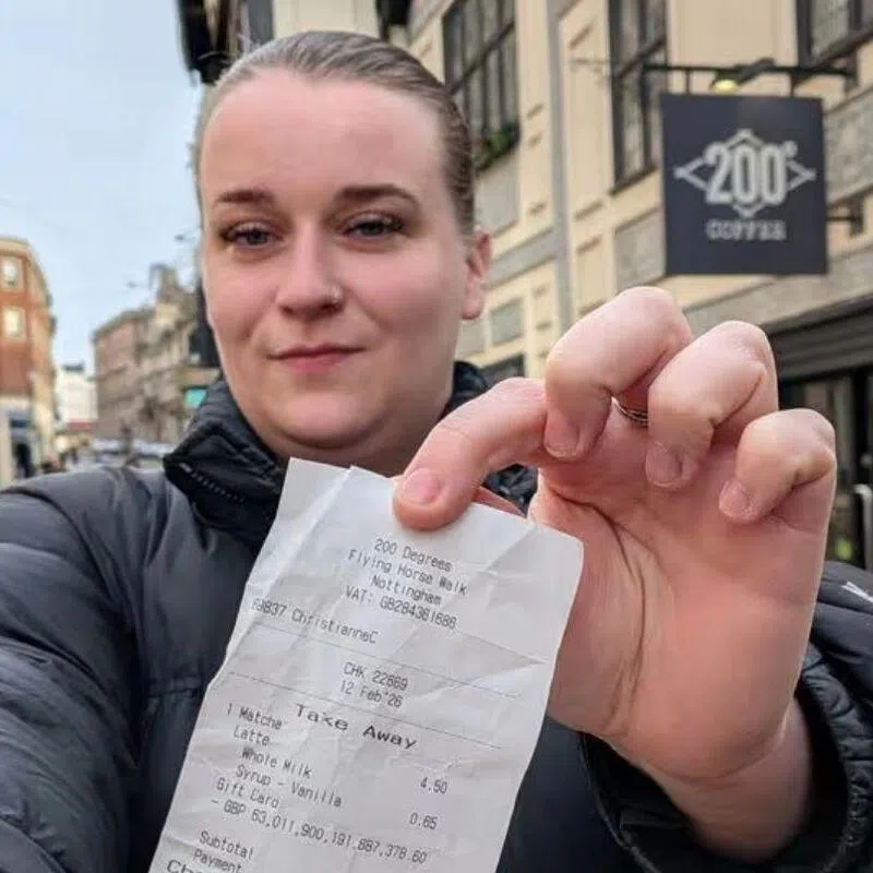 Ms Sophie Downing, a business owner in Nottingham, shows the receipt that gave her a wealth 22,500 times larger than the British economy.