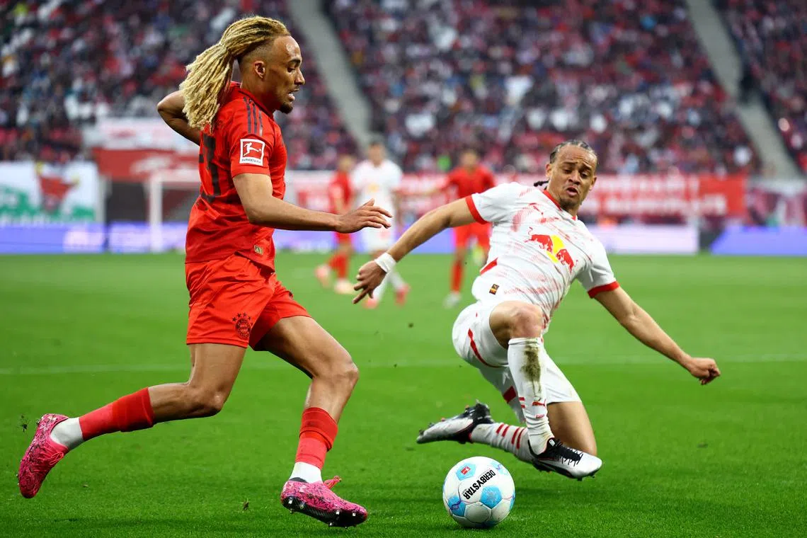 FILE PHOTO: Soccer Football - Bundesliga - RB Leipzig v Bayern Munich - Red Bull Arena, Leipzig, Germany - May 3, 2025 Bayern Munich's Sacha Boey in action with RB Leipzig's Xavi Simons REUTERS/Lisi Niesner/File Photo