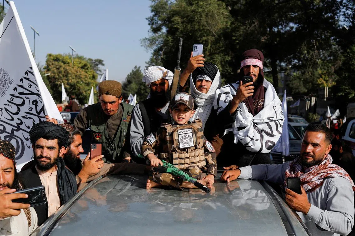 FILE PHOTO: Taliban supporters celebrate on the second anniversary of the fall of Kabul at a street near the U.S. embassy in Kabul, Afghanistan, August 15, 2023. REUTERS/Ali Khara/File Photo