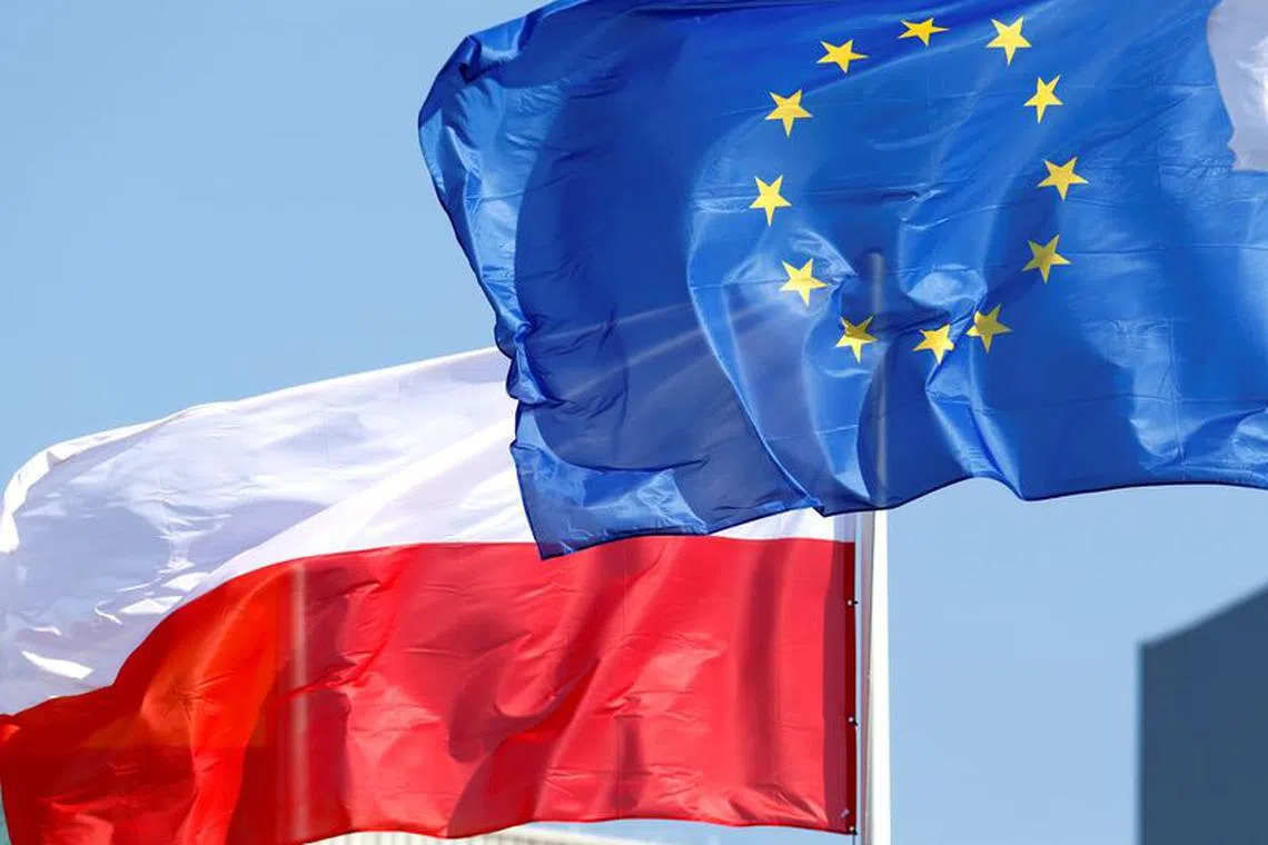 European Union and Poland's flags flutter at the Orlen refinery in Mazeikiai, Lithuania April 5, 2019. REUTERS/Ints Kalnins/File Photo