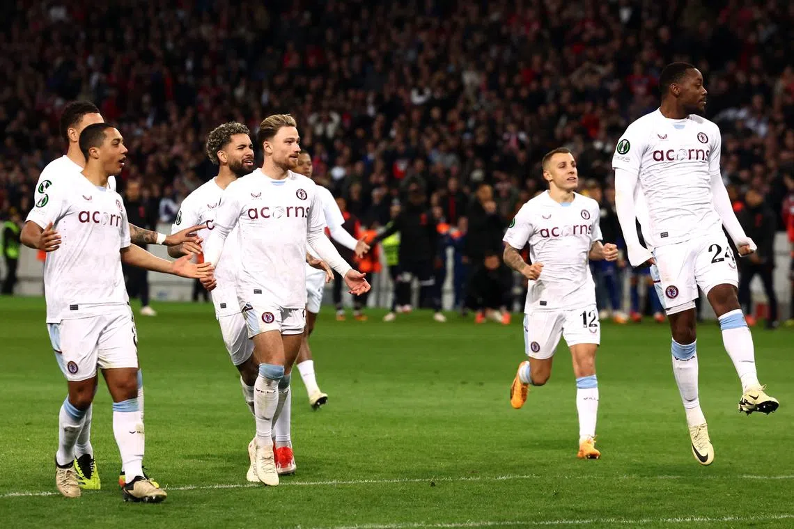 Soccer Football - Europa Conference League - Quarter Final - Second Leg - Lille v Aston Villa - Stade Pierre-Mauroy, Villeneuve-d'Ascq, France - April 18, 2024 Aston Villa's Matty Cash, Youri Tielemans and Jhon Duran celebrate winning the penalty shootout REUTERS/Stephanie Lecocq