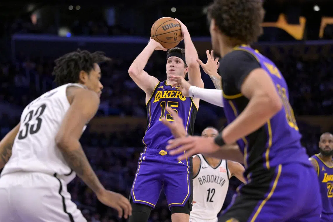 Los Angeles Lakers guard Austin Reaves shooting a three-point basket in the second half against the Brooklyn Nets at Crypto.com Arena. He scored a career-high 38 points, with 15 coming in the final quarter of the 102-101 win on Jan 17.