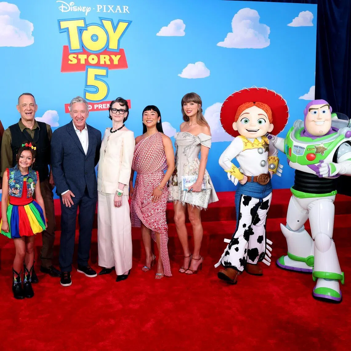 (From left): Conan O'Brien, Scarlett Spears, Tom Hanks, Tim Allen, Joan Cusack, Greta Lee and Taylor Swift attend the Toy Story 5 premiere in Los Angeles, California on June 9, 2026. 