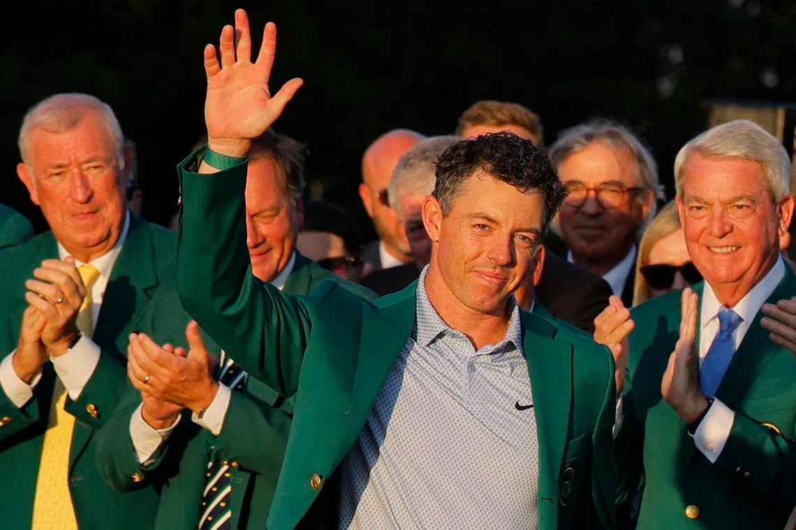 Golf - The Masters - Augusta National Golf Club, Augusta, Georgia, U.S. - April 12, 2026 Northern Ireland's Rory McIlroy celebrates with his green jacket after winning The Masters REUTERS/Mike Blake