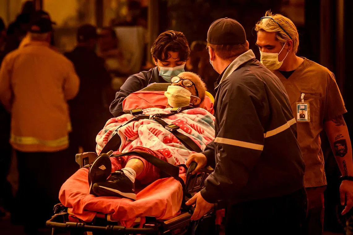 Patients evacuating from the Brighton Care Center during the Eaton Fire in Los Angeles county on Jan 08, 2025. 