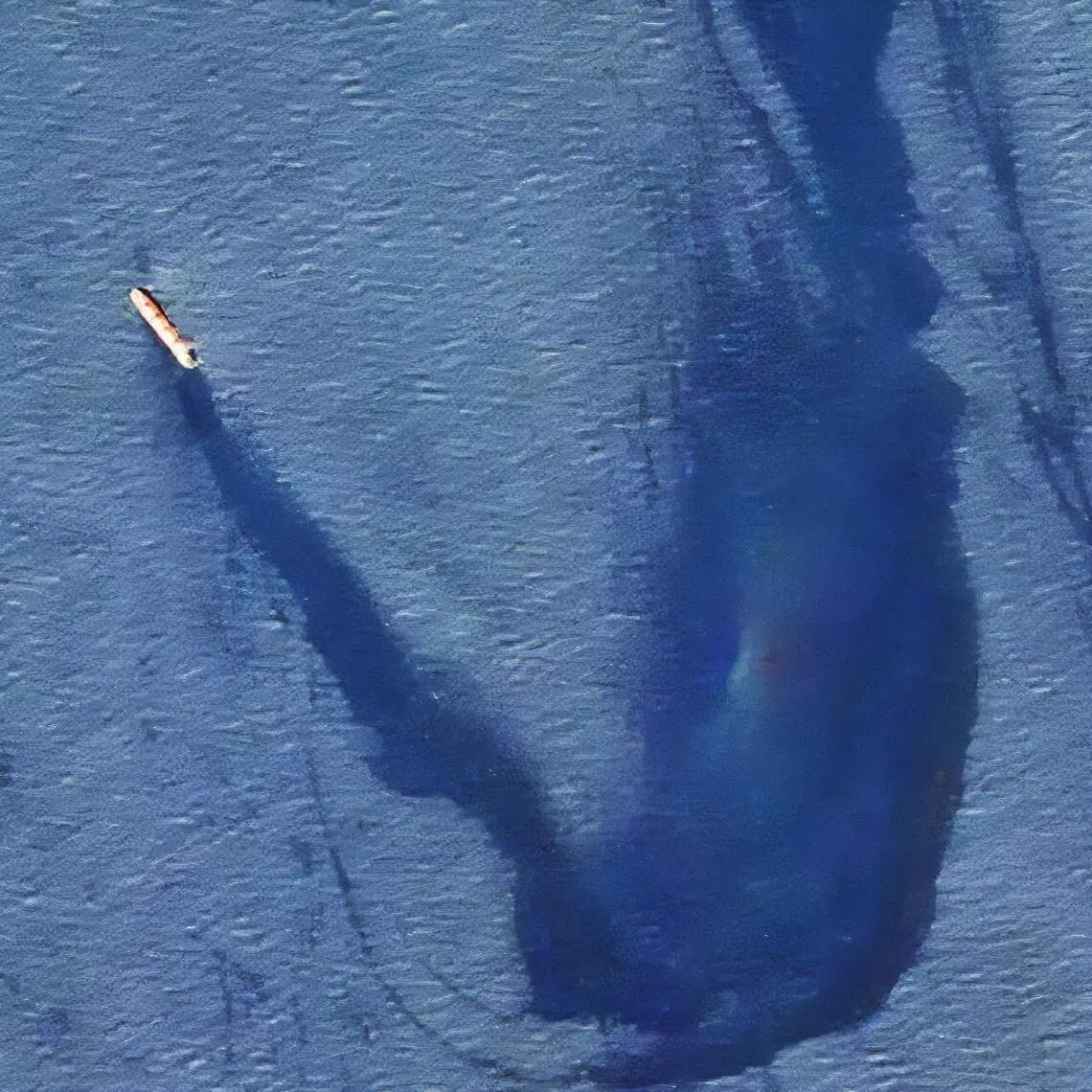A 2024 image released by the US military shows a bulk carrier slowly taking on water and leaking oil after being hit by Iran-backed Houthi militants in the Red Sea.
