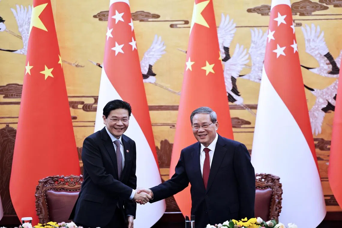 PM Lawrence Wong meeting Chinese Premier Li Qiang in Beijing on June 23.