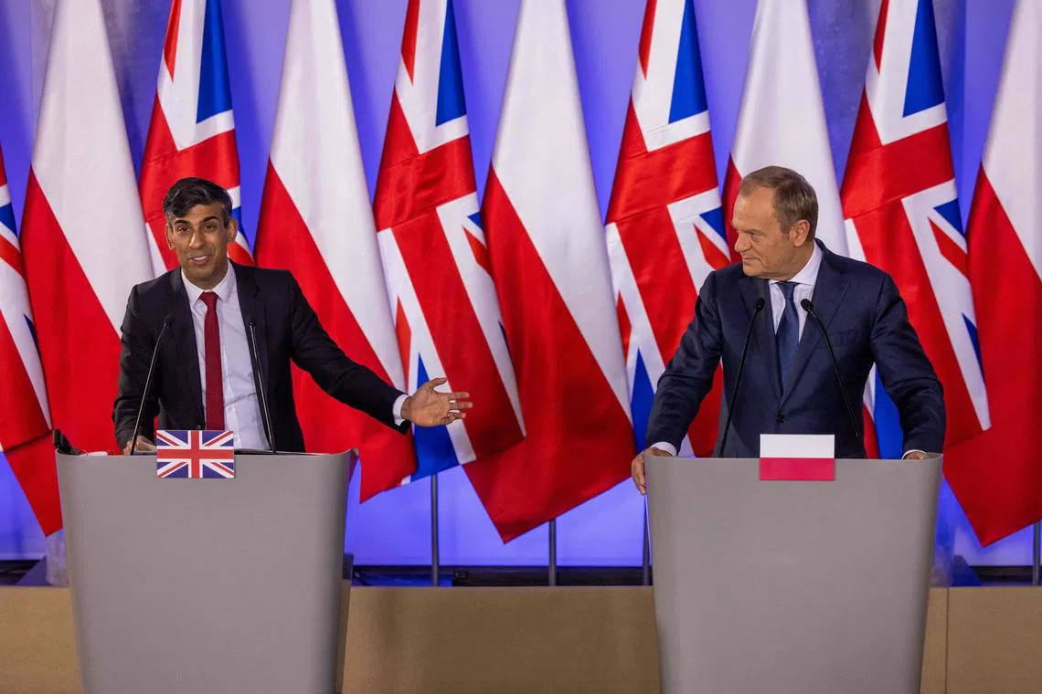 Britain's Prime Minister Rishi Sunak (left) and Polish Prime Minister Donald Tusk addressing a press conference in Warsaw, on April 23, 2024.