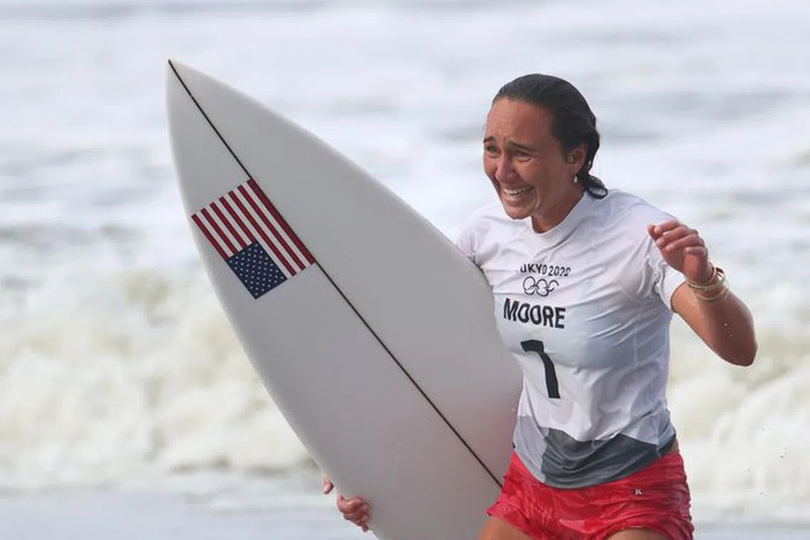 Tokyo 2020 Olympics - Surfing - Women's Shortboard - Gold Medal Match - Tsurigasaki Surfing Beach, Chiba, Japan - July 27, 2021. Carissa Moore of the United States celebrates after winning gold REUTERS/Lisi Niesner/File Photo
