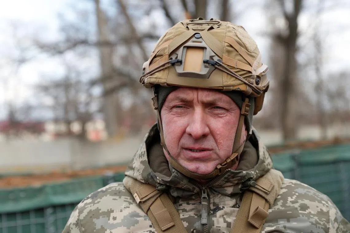 FILE PHOTO: Commander of the Joint Forces Oleksandr Pavliuk visits combat positions of the Ukrainian armed forces near the line of separation from Russian-backed rebels, near the village of Bohdanivka in the Donetsk region, Ukraine February 19, 2022. REUTERS/Valentyn Ogirenko/File Photo