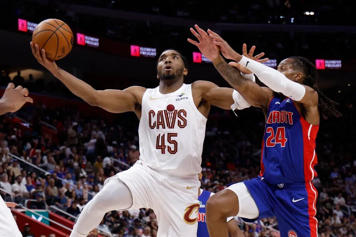 Cleveland Cavaliers guard Donovan Mitchell (left) shoots on Detroit Pistons guard Daniss Jenkins during game seven of the second round of the 2026 NBA Playoffs.