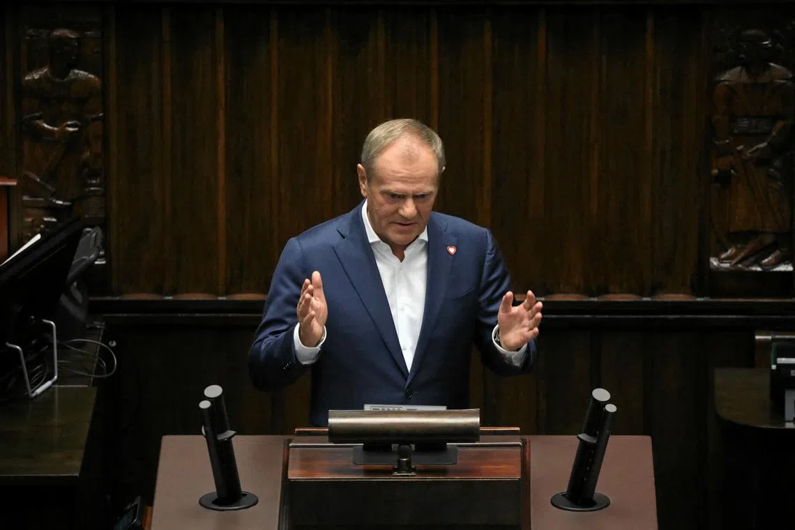 Poland's Prime Minister Donald Tusk speaks after President Andrzej Duda addressed the parliament one year after a general election resulted in a change of government, in Warsaw, Poland, October 16, 2024. Slawomir Kaminski/Agencja Wyborcza.pl via REUTERS