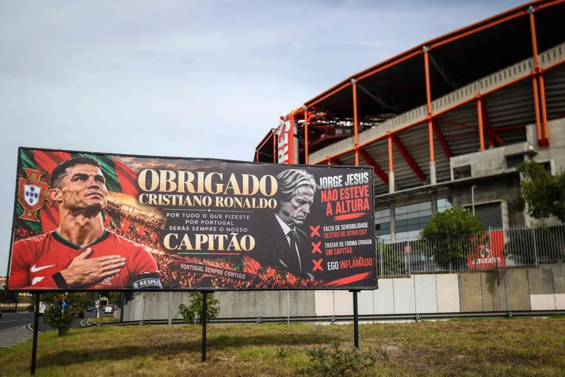 A billboard in support of Portugal forward Cristiano Ronaldo mixed with an adjacent message critical against Portugal coach Jorge Jesus in Lisbon.