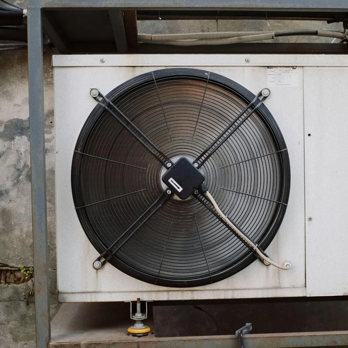 The dead person was a 24-year-old contractor who was working on an air-conditioning unit.