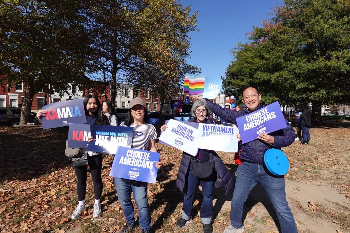 Ms Tilly Chang (second from left), Ms Andrea Wong (second from right), and Mr Alex Sun (right) travelled to Philadelphia from their home states to canvas for Ms Harris.