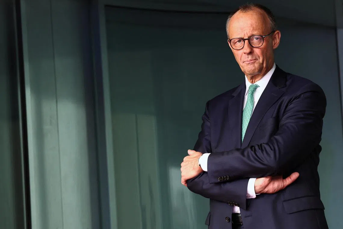 German Chancellor Friedrich Merz waits to welcome Swiss President Karin Keller-Sutter, at the Chancellery in Berlin, Germany, September 2, 2025. REUTERS/Liesa Johannssen