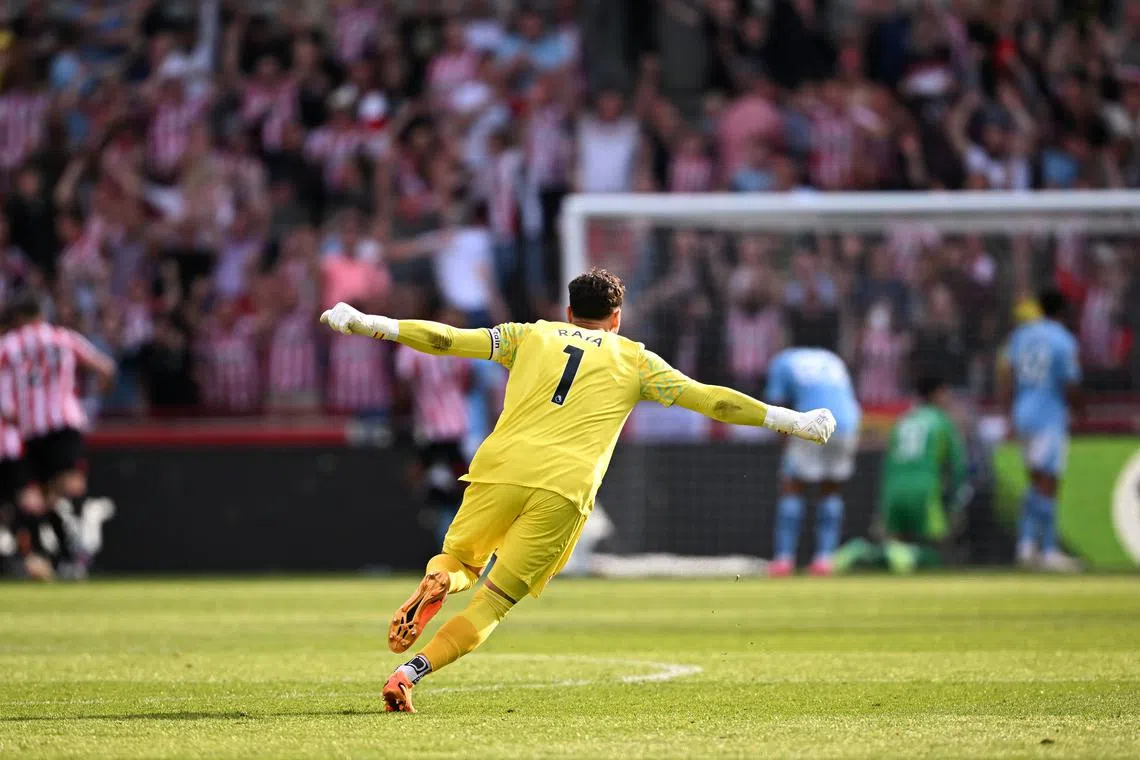 Brentford's David Raya celebrates after Ethan Pinnock scores their first goal.
