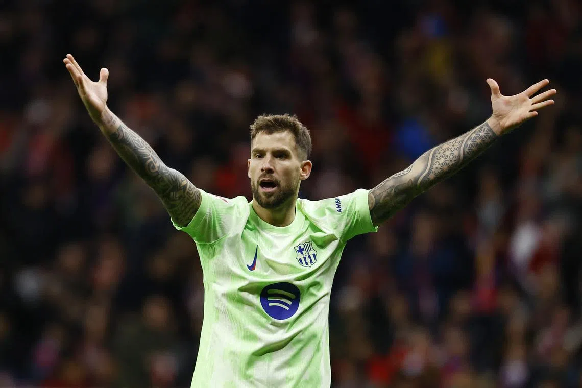 FILE PHOTO: Soccer Football - LaLiga - Atletico Madrid v FC Barcelona - Metropolitano, Madrid, Spain - March 16, 2025 FC Barcelona's Inigo Martinez reacts REUTERS/Susana Vera/File Photo