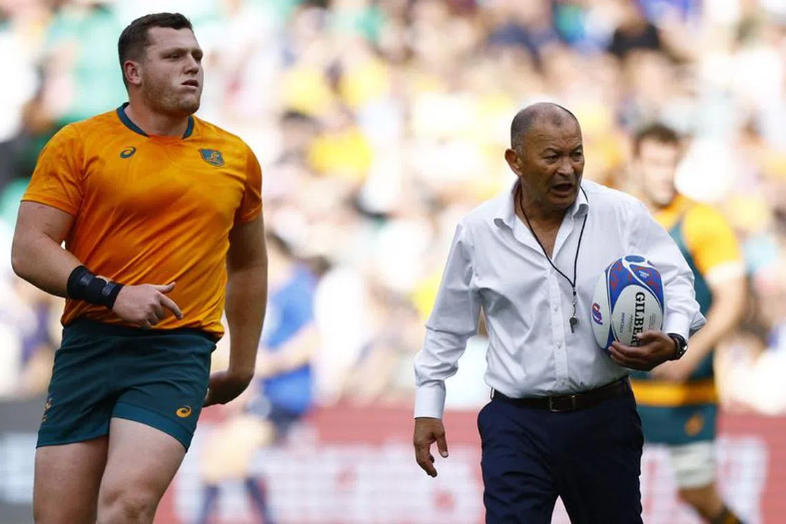 Rugby Union - Rugby World Cup 2023 - Pool C - Australia v Fiji - Stade Geoffroy-Guichard, Saint-Etienne, France - September 17, 2023  Australia's Angus Bell and head coach Eddie Jones before the match REUTERS/Sarah Meyssonnier