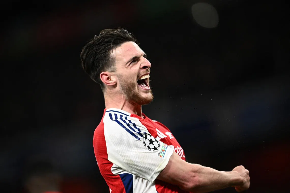 Soccer Football - Champions League - Quarter Final - First Leg - Arsenal v Real Madrid - Emirates Stadium, London, Britain - April 8, 2025 Arsenal's Declan Rice celebrates scoring their first goal REUTERS/Dylan Martinez
