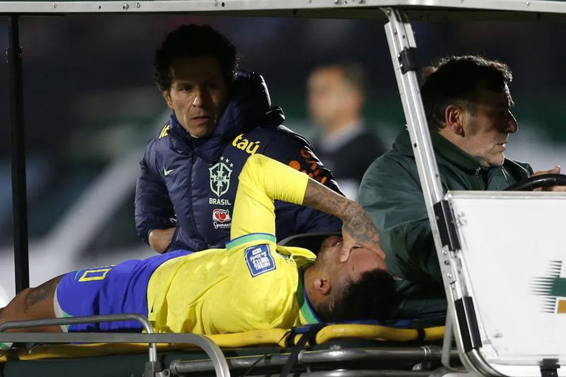 Soccer Football - World Cup - South American Qualifiers - Uruguay v Brazil - Estadio Centenario, Montevideo, Uruguay - October 17, 2023 Brazil's Neymar is brought off the pitch after sustaining an injury REUTERS/Andres Cuenca