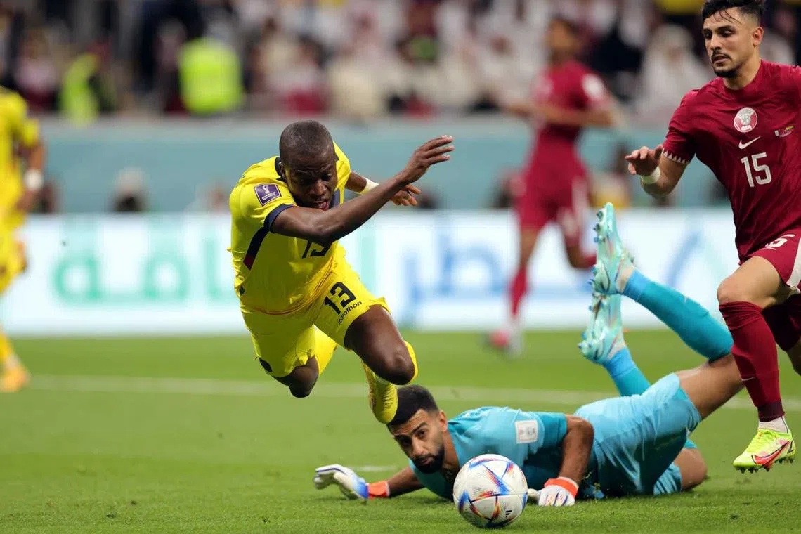 Enner Valencia of Ecuador is fouled for a penalty by Goalkeeper Saad Alsheeb of Qatar during the FIFA World Cup 2022 group A Opening Match between Qatar and Ecuador at Al Bayt Stadium in Al Khor, Qatar, Nov 20, 2022. 