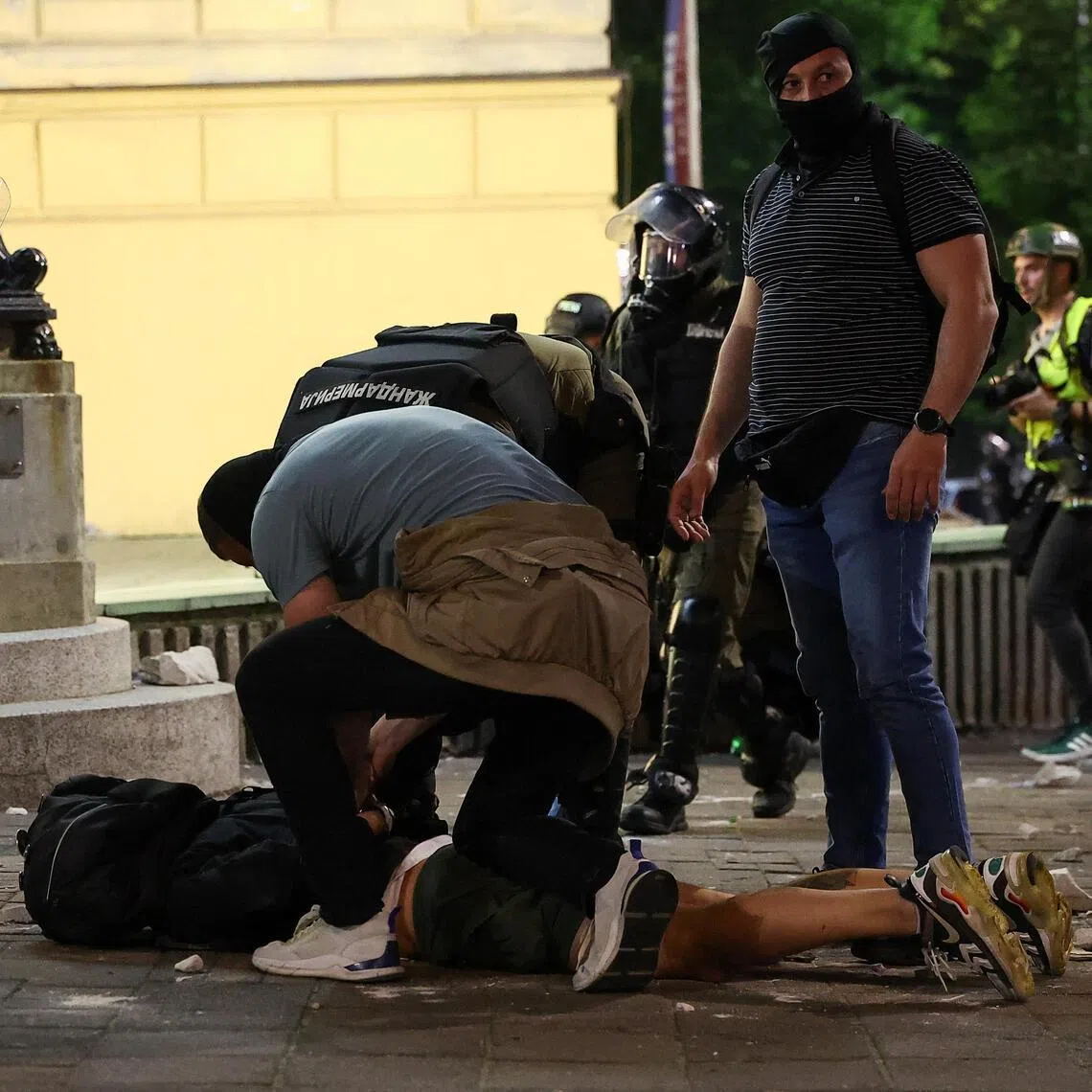 A demonstrator is handcuffed during a student-led protest demanding snap parliamentary elections, in Belgrade, Serbia, on May 23.