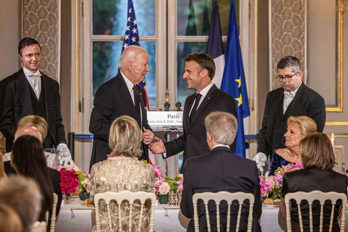 France's President Emmanuel Macron, France's first lady Brigitte Macron (obscured), U.S. President Joe Biden and U.S. first lady Jill Biden attend a gala dinner at the Elysee Palace in Paris, France June 8, 2024.    CHRISTOPHE PETIT TESSON/Pool via REUTERS/File Photo