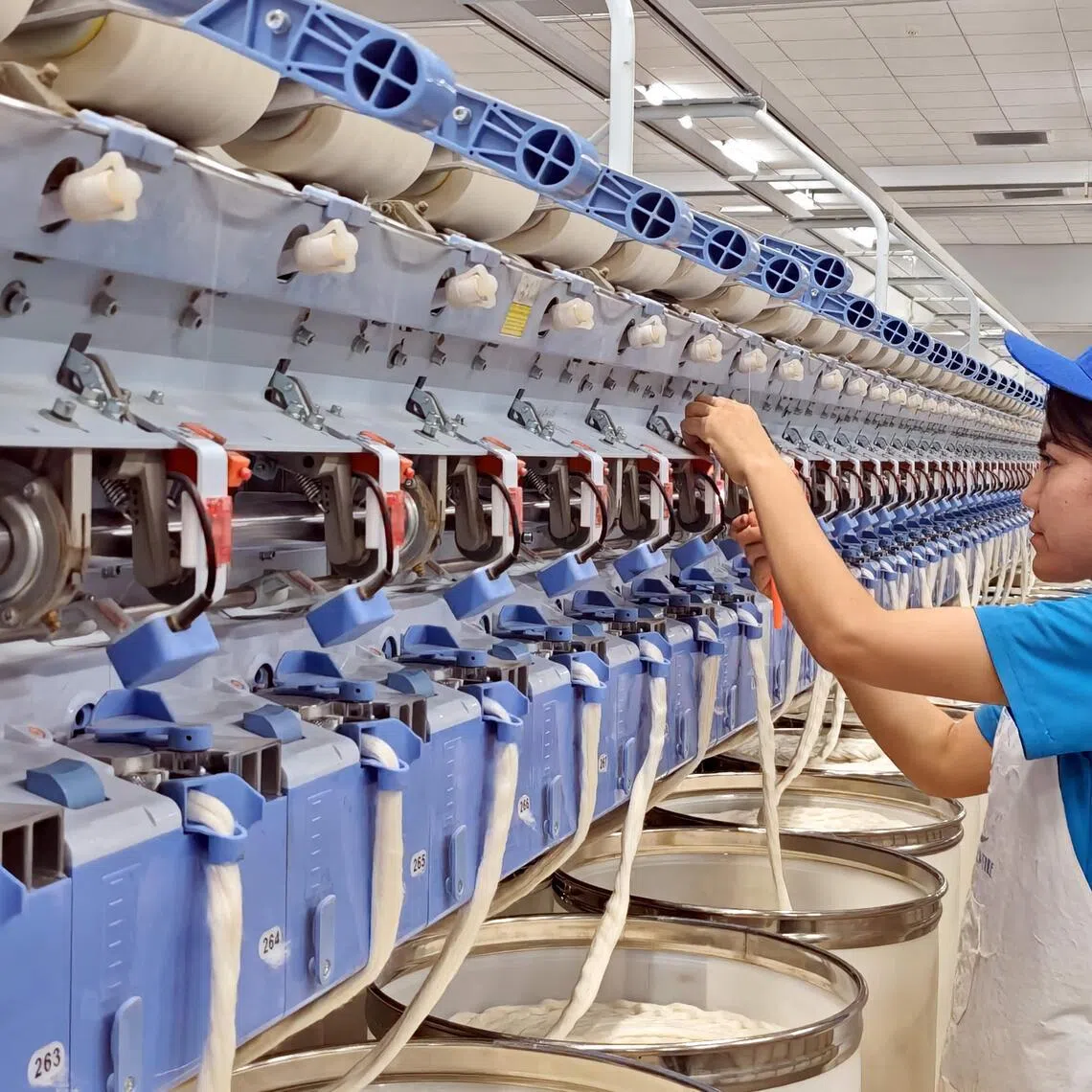 An employee at a textile factory in Awat city, Xinjiang.