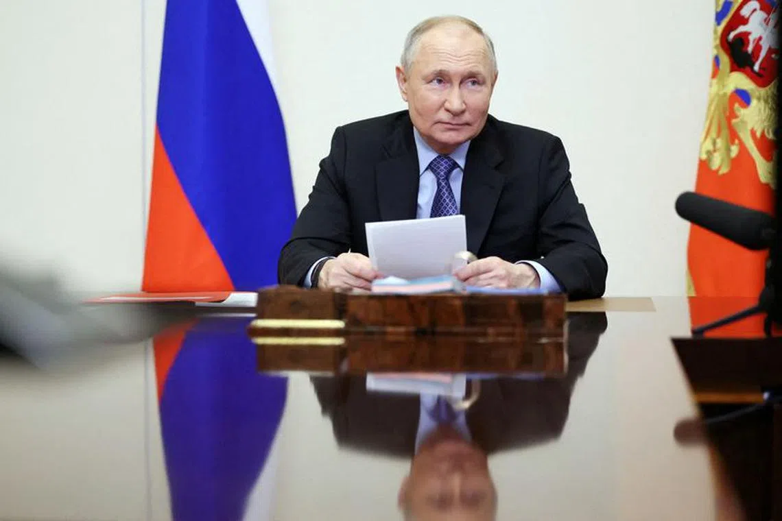 Russian President Vladimir Putin chairs a meeting with members of the Security Council via video link at the Novo-Ogaryovo state residence outside Moscow, Russia February 13, 2024. Sputnik/Alexander Kazakov/Pool via REUTERS