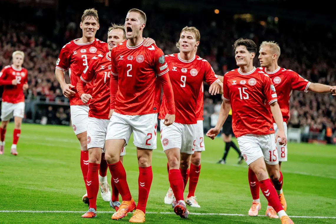 Soccer Football - FIFA World Cup - UEFA Qualifiers - Group C - Denmark v Greece - Parken, Copenhagen, Denmark - October 12, 2025  Denmark's Joachim Andersen celebrates scoring their second goal with teammates Mads Claus Rasmussen/Ritzau Scanpix via REUTERS