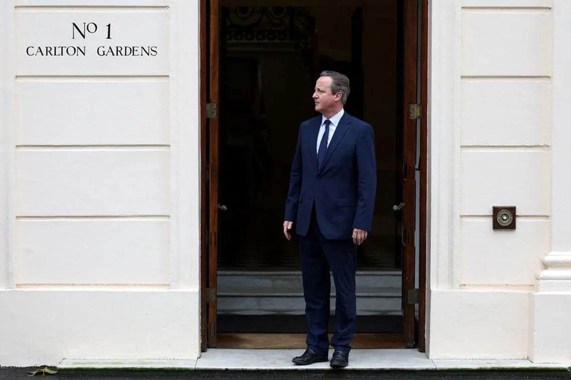 FILE PHOTO: Britain's Foreign Secretary David Cameron waits to greet Ireland's Deputy Prime Minister and Foreign Minister Micheal Martin at Carlton Gardens, in central London, Britain December 13, 2023.     ADRIAN DENNIS/Pool via REUTERS/File Photo